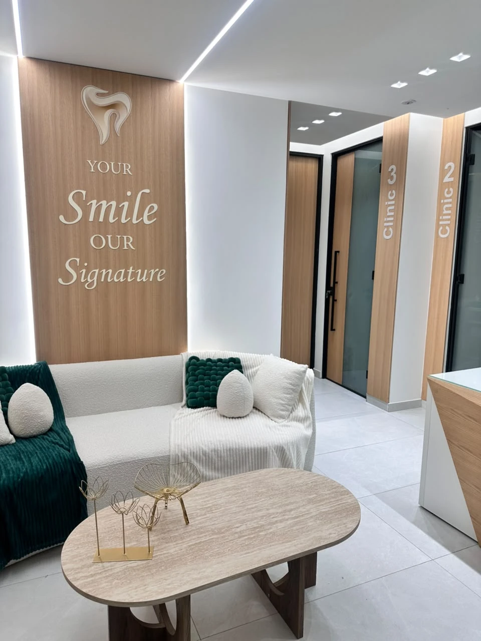 The waiting area and glass treatment-room doors at Signature Smile